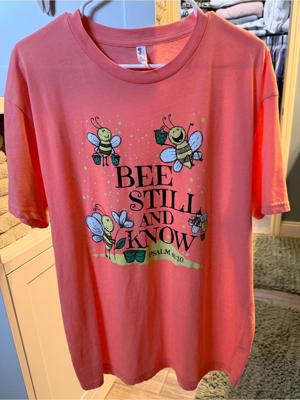 Love In Faith Bee Still and Know Coral Graphic Tee